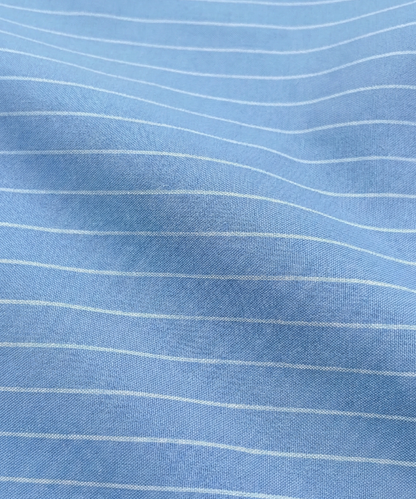 Close-up specialized jacquard polyamide fabric texture on DapperTee Danish Sea blue shirt.