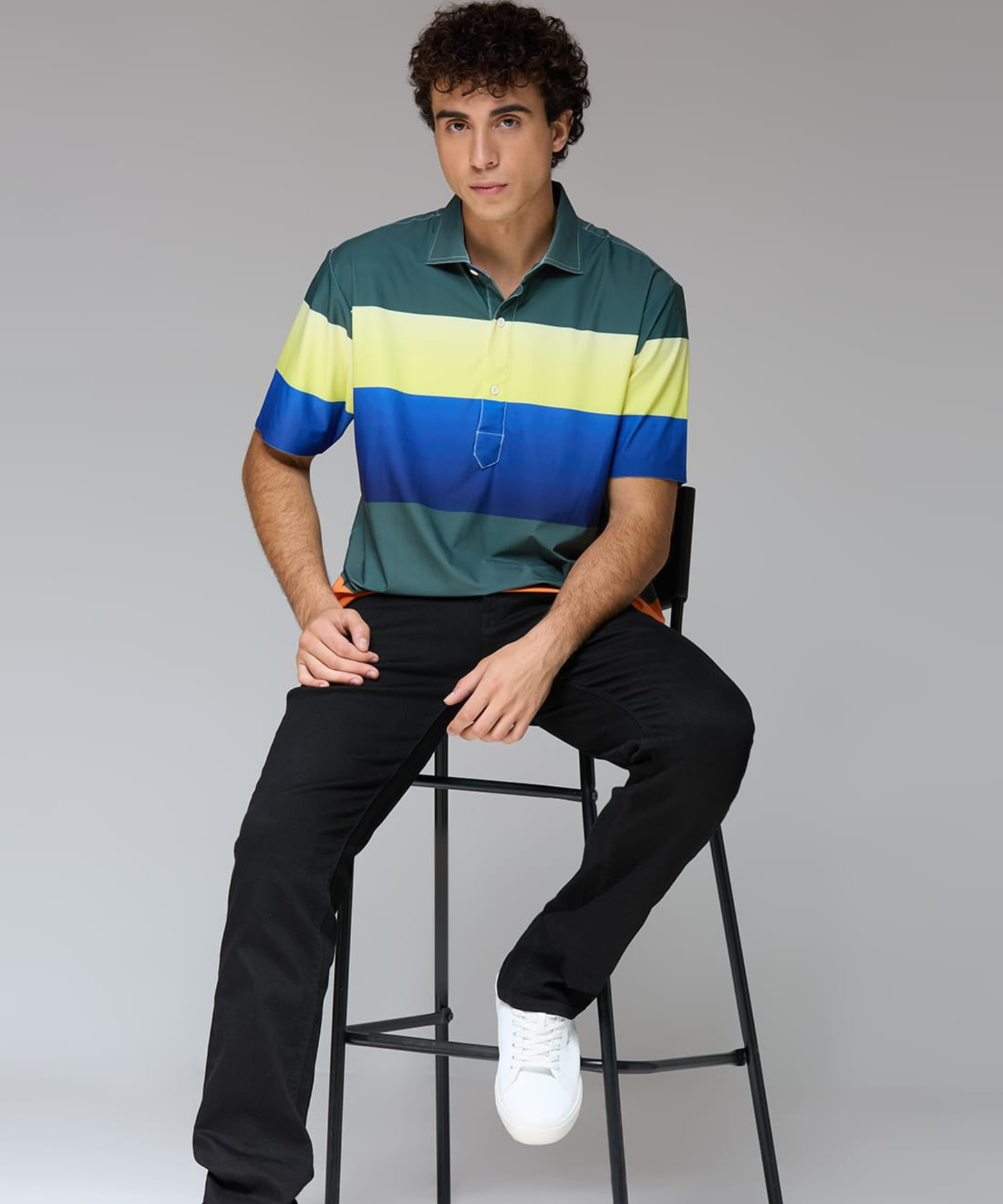 DapperTee Multi Stripe polo showcasing relaxed fit for professional men’s athletic style.