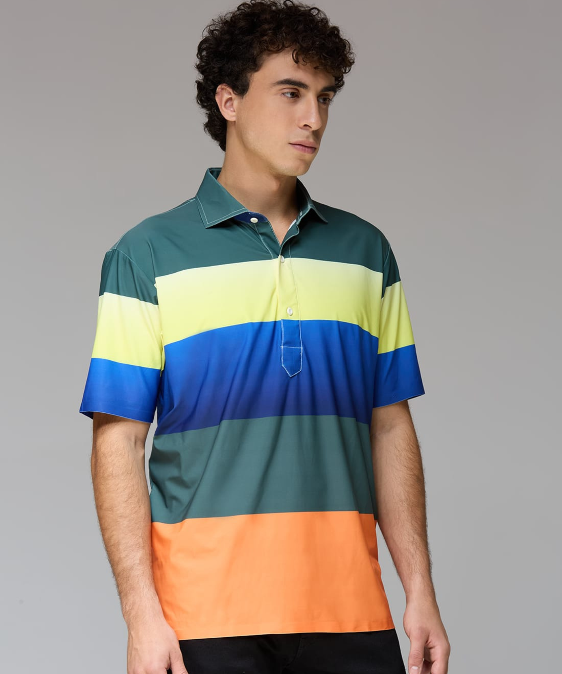 Well groomed model wearing DapperTee Multi Stripe polo for premium golf aesthetic.