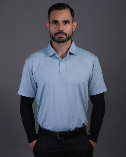 Model wearing DapperTee blue knit polo for a premium corporate boardroom aesthetic.