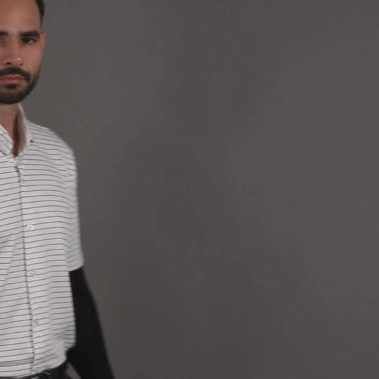 Performance video showcasing DapperTee stretchable open polo shirt during a professional presentation.