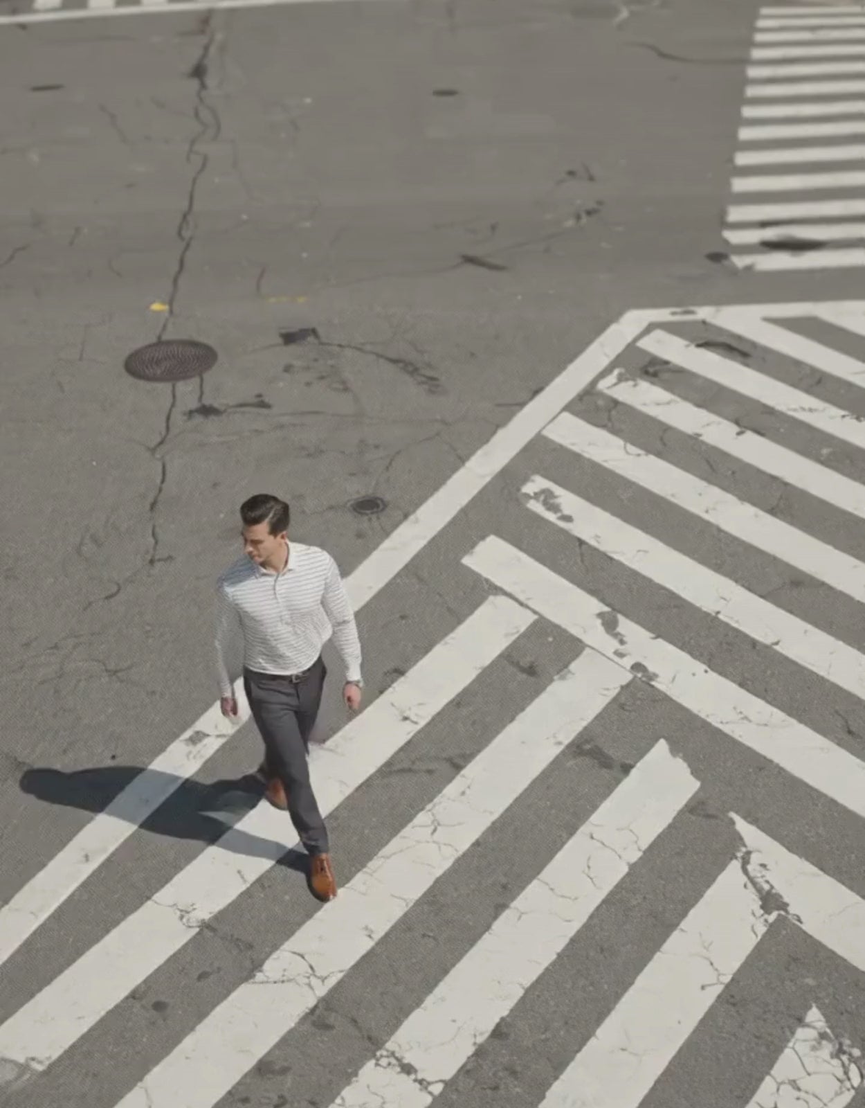 Performance video showcasing DapperTee stretchable long sleeve polo during professional city movement.