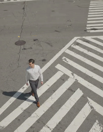 Performance video showcasing DapperTee stretchable long sleeve polo during professional city movement.