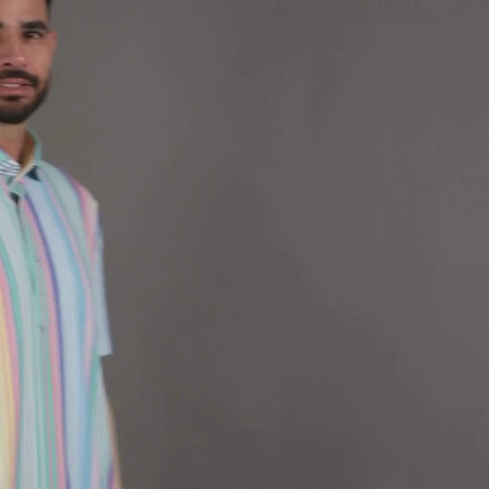 DapperTee Vertical Luxe Stripes polo featuring crisp collar and signature V-placket design.