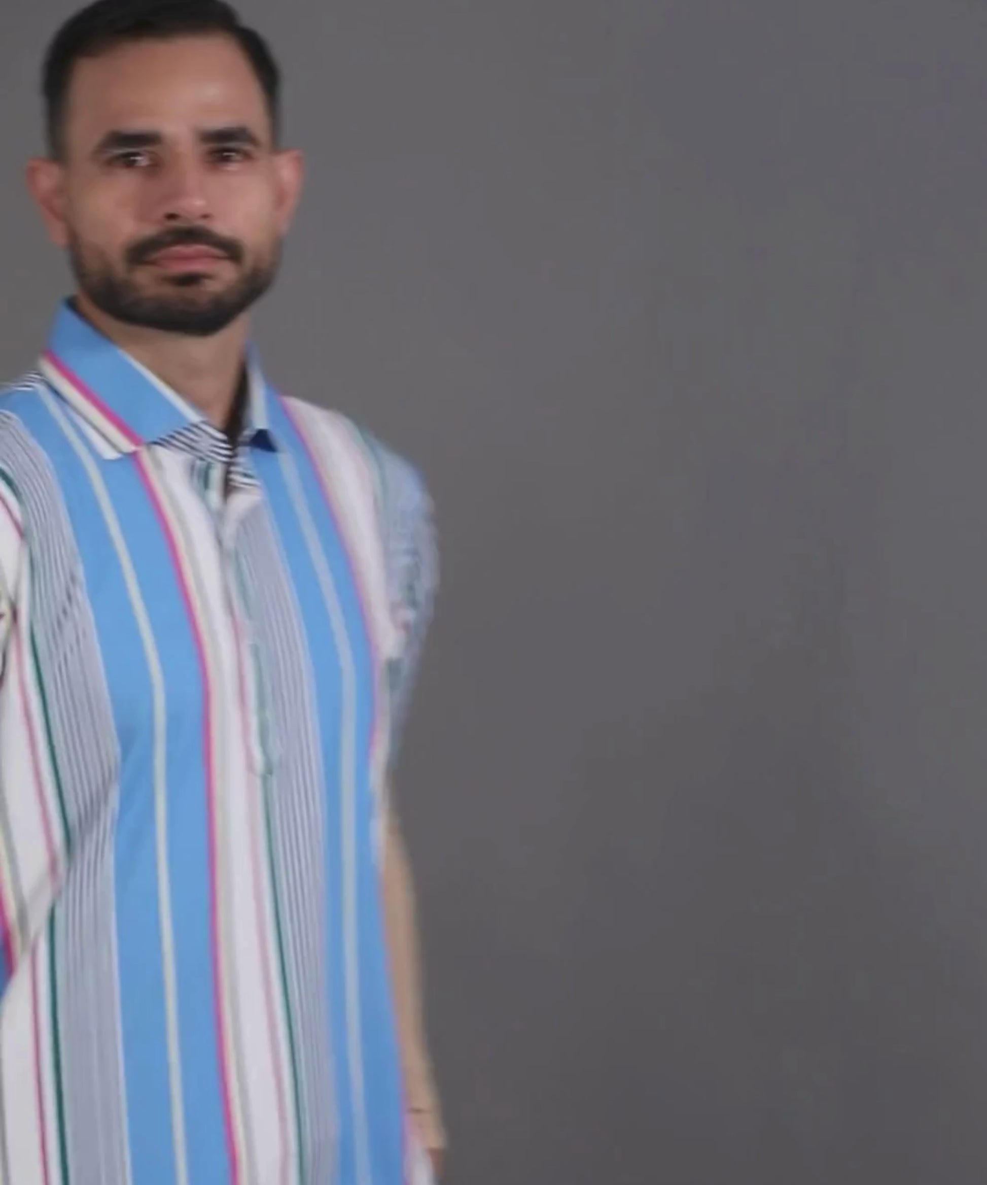 DapperTee blue vertical stripe luxury office polo with signature V-placket design.